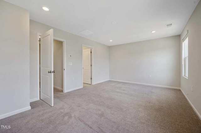 carpeted spare room with baseboards and recessed lighting