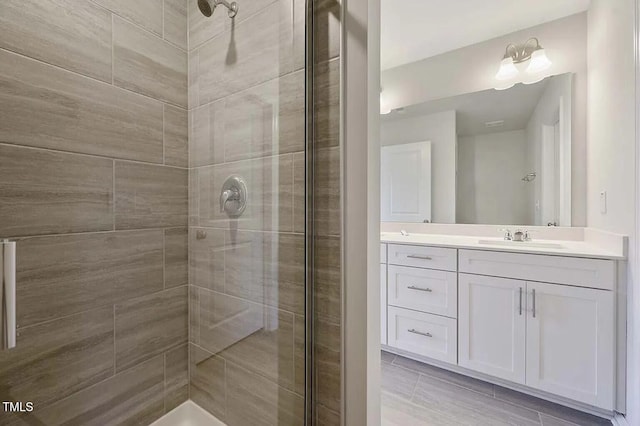 full bath featuring a shower stall and vanity