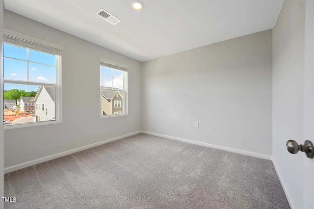 carpeted spare room with baseboards and recessed lighting