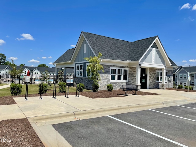 view of building exterior featuring uncovered parking