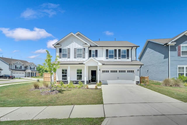 4601 Okeechobee Ct, Fuquay Varina, NC 27526 - view of front of house with board and batten siding, concrete driveway, an attached garage, and a front lawn