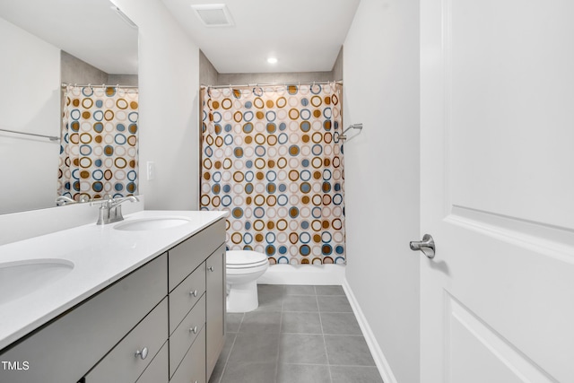 4601 Okeechobee Ct, Fuquay Varina, NC 27526 - full bath featuring a shower with shower curtain, tile patterned flooring, toilet, double vanity, and baseboards