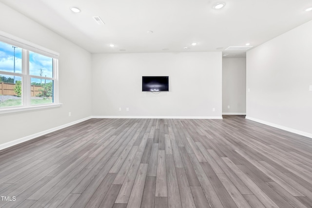 4601 Okeechobee Ct, Fuquay Varina, NC 27526 - unfurnished living room with wood finished floors, baseboards, and recessed lighting