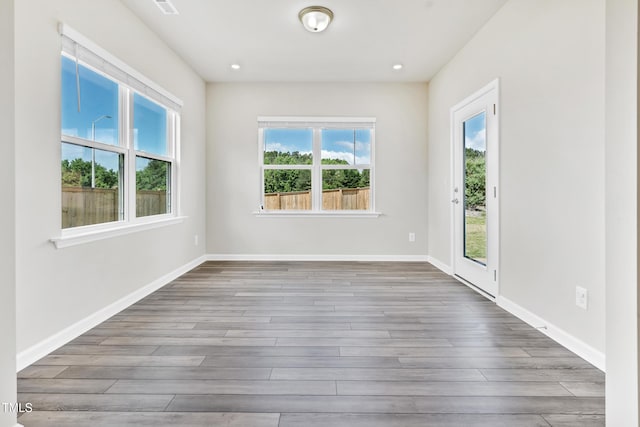 4601 Okeechobee Ct, Fuquay Varina, NC 27526 - spare room featuring plenty of natural light, wood finished floors, baseboards, and recessed lighting