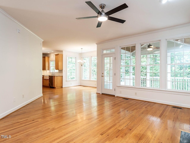 203 Chilcott Ln, Apex, NC 27502 - unfurnished living room with ornamental molding, ceiling fan, light wood-style floors, and baseboards