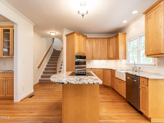 203 Chilcott Ln, Apex, NC 27502 - kitchen with stainless steel appliances, a sink, ornamental molding, backsplash, and recessed lighting