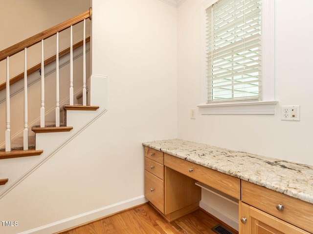 203 Chilcott Ln, Apex, NC 27502 - unfurnished office with light wood finished floors, baseboards, and built in study area