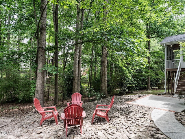 203 Chilcott Ln, Apex, NC 27502 - view of patio featuring stairway, a sunroom, and an outdoor fire pit