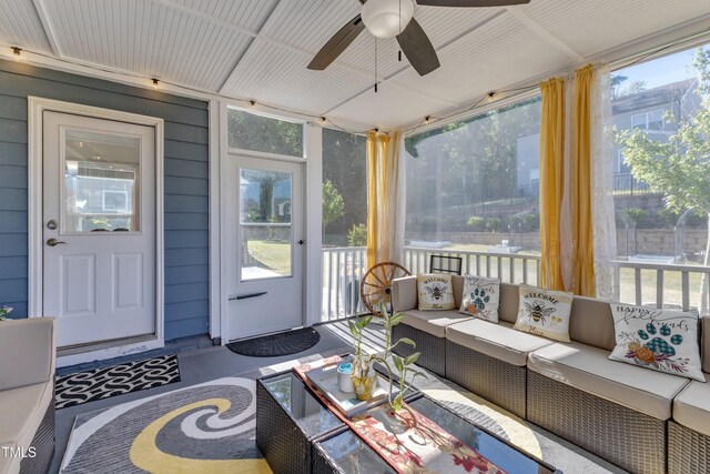 sunroom / solarium with a ceiling fan, outdoor lounge area, and plenty of natural light