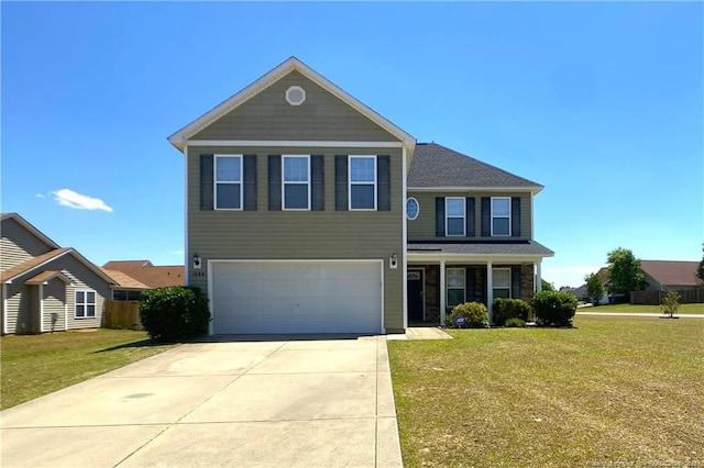 view of front facade with a garage, a front yard, and driveway