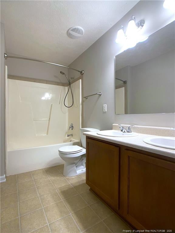 full bath featuring toilet, tile patterned flooring, double vanity, shower / tub combination, and a textured ceiling