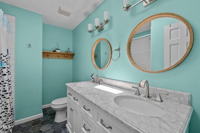 bathroom featuring toilet, double vanity, baseboards, tile patterned flooring, and a shower with curtain