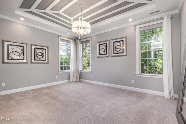 carpeted empty room with a tray ceiling, ornamental molding, a chandelier, recessed lighting, and baseboards