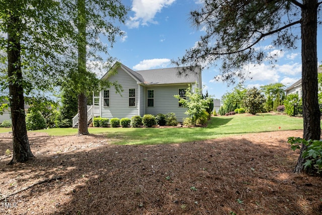 view of property exterior featuring a yard