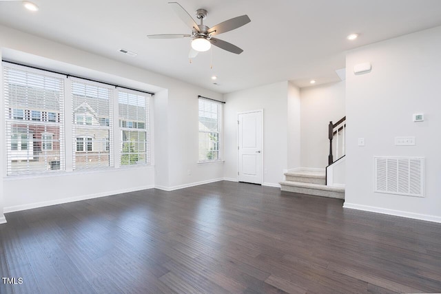 unfurnished living room featuring a ceiling fan, stairway, dark wood finished floors, recessed lighting, and baseboards