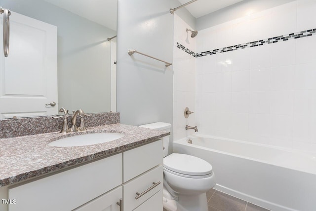 bathroom featuring toilet, shower / bath combination, vanity, and tile patterned floors