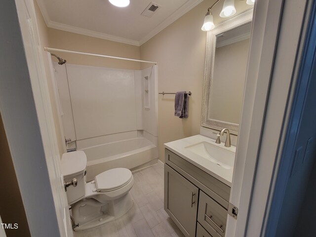 bathroom with toilet, vanity, ornamental molding, and washtub / shower combination