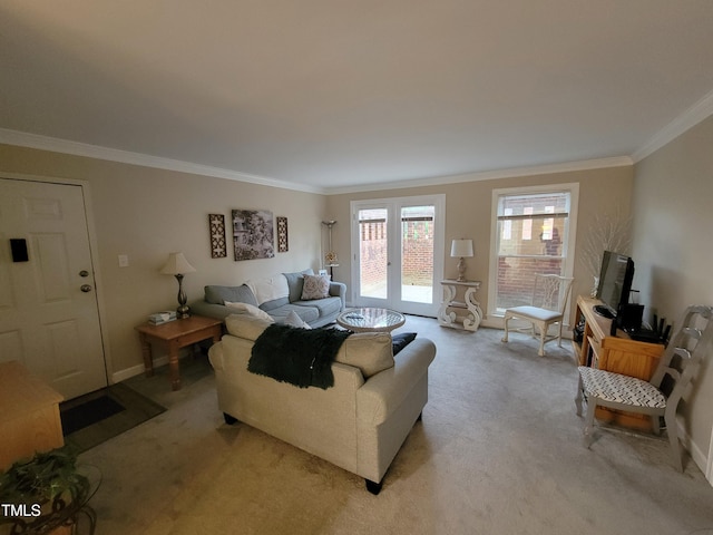 living room featuring ornamental molding, light colored carpet, and baseboards