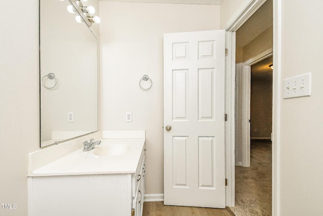 bathroom featuring vanity and baseboards