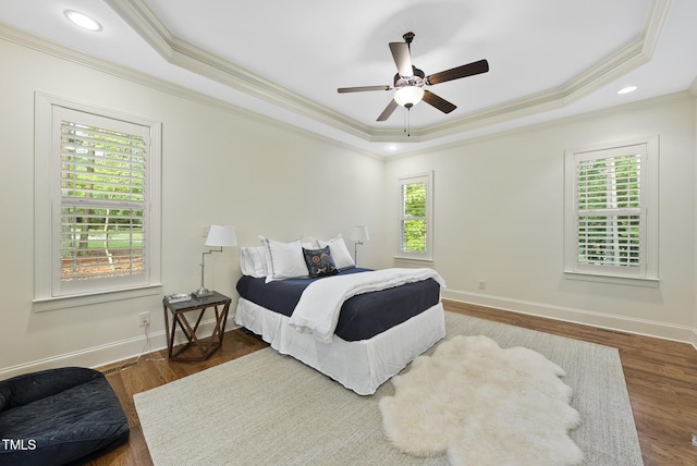 1211 New Grissom Way, Wake Forest, NC 27587 - bedroom featuring ornamental molding, a raised ceiling, baseboards, wood finished floors, and recessed lighting