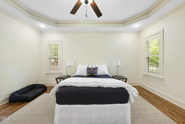 1211 New Grissom Way, Wake Forest, NC 27587 - bedroom with wood finished floors, ornamental molding, baseboards, a raised ceiling, and a ceiling fan