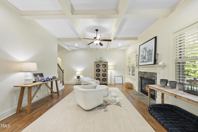 1211 New Grissom Way, Wake Forest, NC 27587 - living room featuring a fireplace, stairs, coffered ceiling, beamed ceiling, and dark wood-type flooring