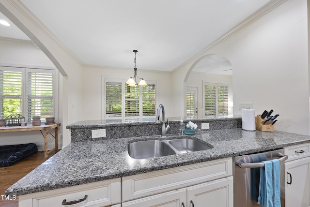 1211 New Grissom Way, Wake Forest, NC 27587 - kitchen featuring a sink, dishwasher, arched walkways, wood finished floors, and dark stone countertops