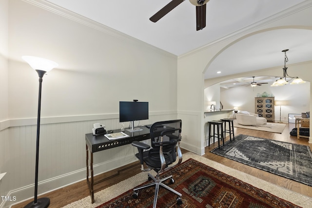 1211 New Grissom Way, Wake Forest, NC 27587 - home office featuring a ceiling fan, wood finished floors, a wainscoted wall, arched walkways, and ornamental molding