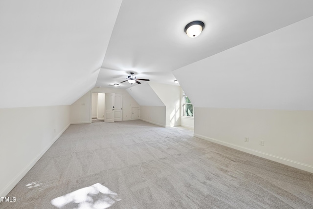 1211 New Grissom Way, Wake Forest, NC 27587 - additional living space with light colored carpet, baseboards, lofted ceiling, and ceiling fan