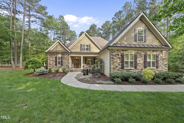 1211 New Grissom Way, Wake Forest, NC 27587 - craftsman-style house with a standing seam roof, a front yard, a porch, stone siding, and metal roof
