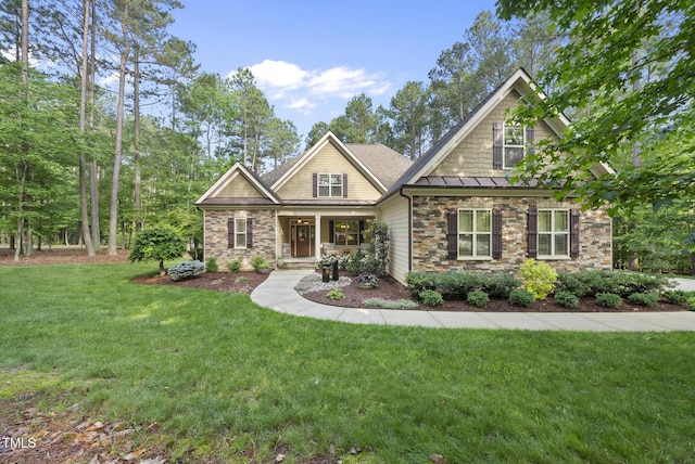 1211 New Grissom Way, Wake Forest, NC 27587 - craftsman house with stone siding, a standing seam roof, a front lawn, covered porch, and metal roof