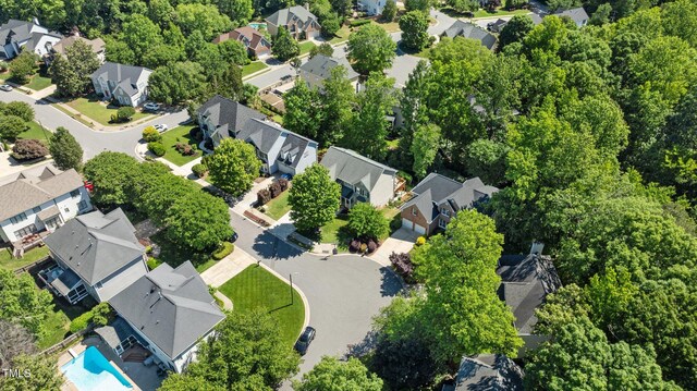 aerial perspective of suburban area featuring a pool