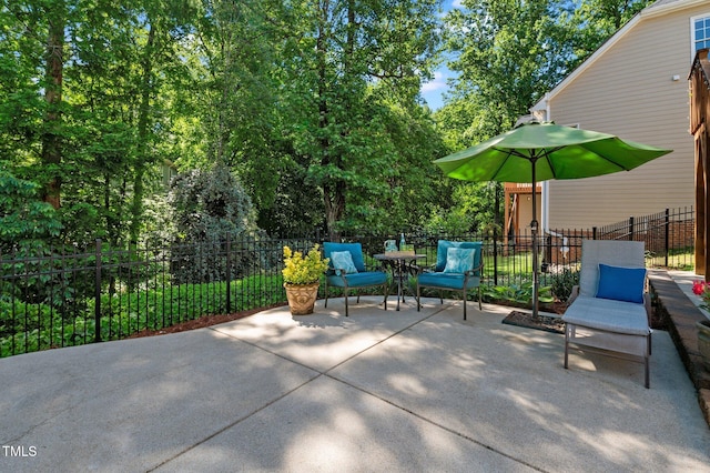 view of patio / terrace featuring fence