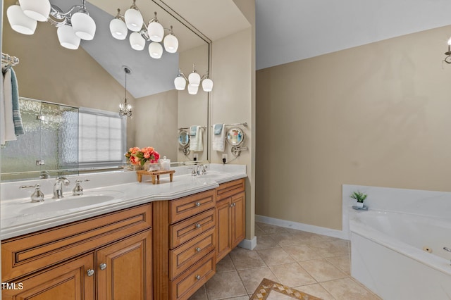 full bathroom featuring lofted ceiling, a chandelier, tile patterned flooring, a bath, and double vanity