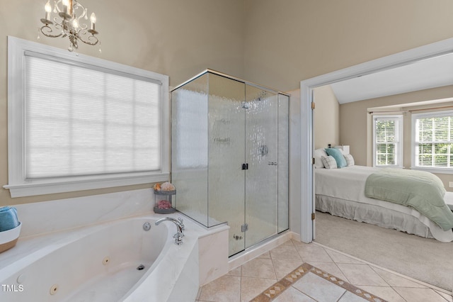 bathroom with ensuite bath, tile patterned flooring, a stall shower, a jetted tub, and a chandelier