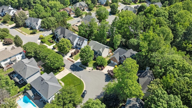 aerial perspective of suburban area featuring a pool