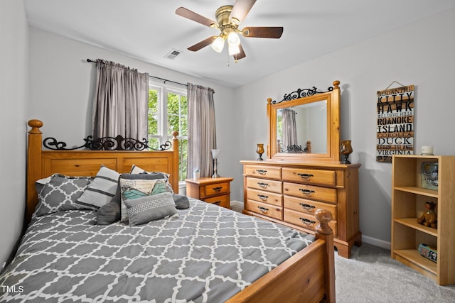bedroom featuring light carpet, baseboards, and a ceiling fan