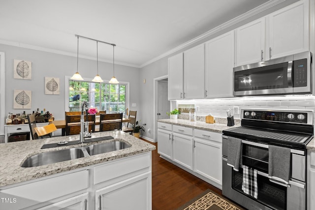 kitchen with stainless steel appliances, a sink, decorative backsplash, white cabinetry, and crown molding