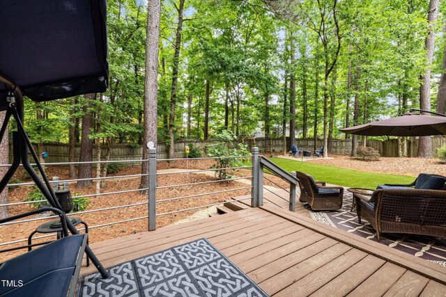 1204 Benoit Pl, Apex, NC 27502 - wooden deck featuring a fenced backyard and view of scattered trees
