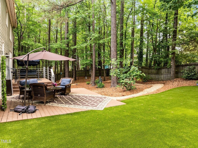 view of yard featuring a wooden deck