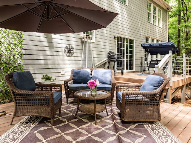 wooden terrace featuring outdoor lounge area