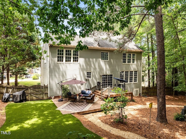 rear view of property with a deck