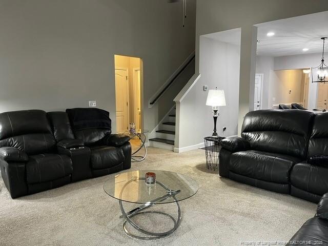 116 Georgia Dr, Raeford, NC 28376 - living room featuring carpet floors, stairs, recessed lighting, a chandelier, and baseboards