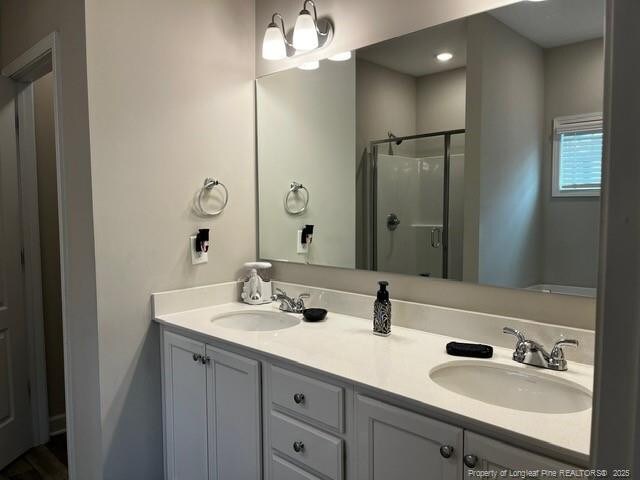 116 Georgia Dr, Raeford, NC 28376 - bathroom featuring a shower stall and double vanity