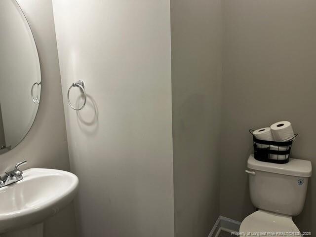 116 Georgia Dr, Raeford, NC 28376 - half bath with a sink and toilet