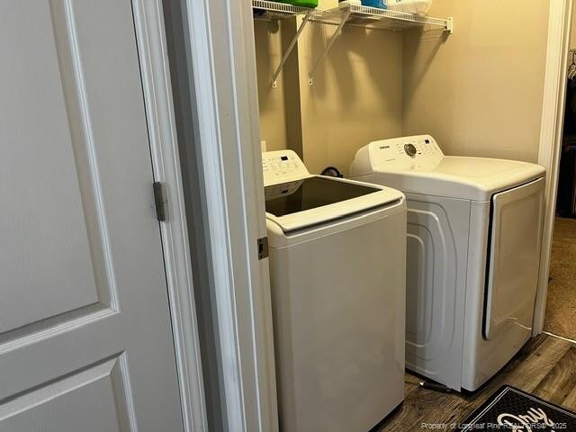 116 Georgia Dr, Raeford, NC 28376 - clothes washing area with independent washer and dryer and dark wood-type flooring