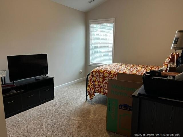 116 Georgia Dr, Raeford, NC 28376 - bedroom featuring vaulted ceiling, carpet, and baseboards