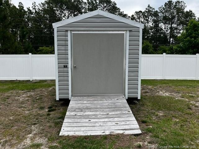 116 Georgia Dr, Raeford, NC 28376 - view of shed featuring fence