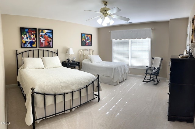 bedroom featuring carpet, baseboards, and a ceiling fan