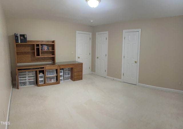 unfurnished office with carpet and baseboards
